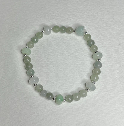 Natural Type A Icy Burmese Jadeite Jade Sterling Silver Stretch Bracelet with round and lotus bud beads.