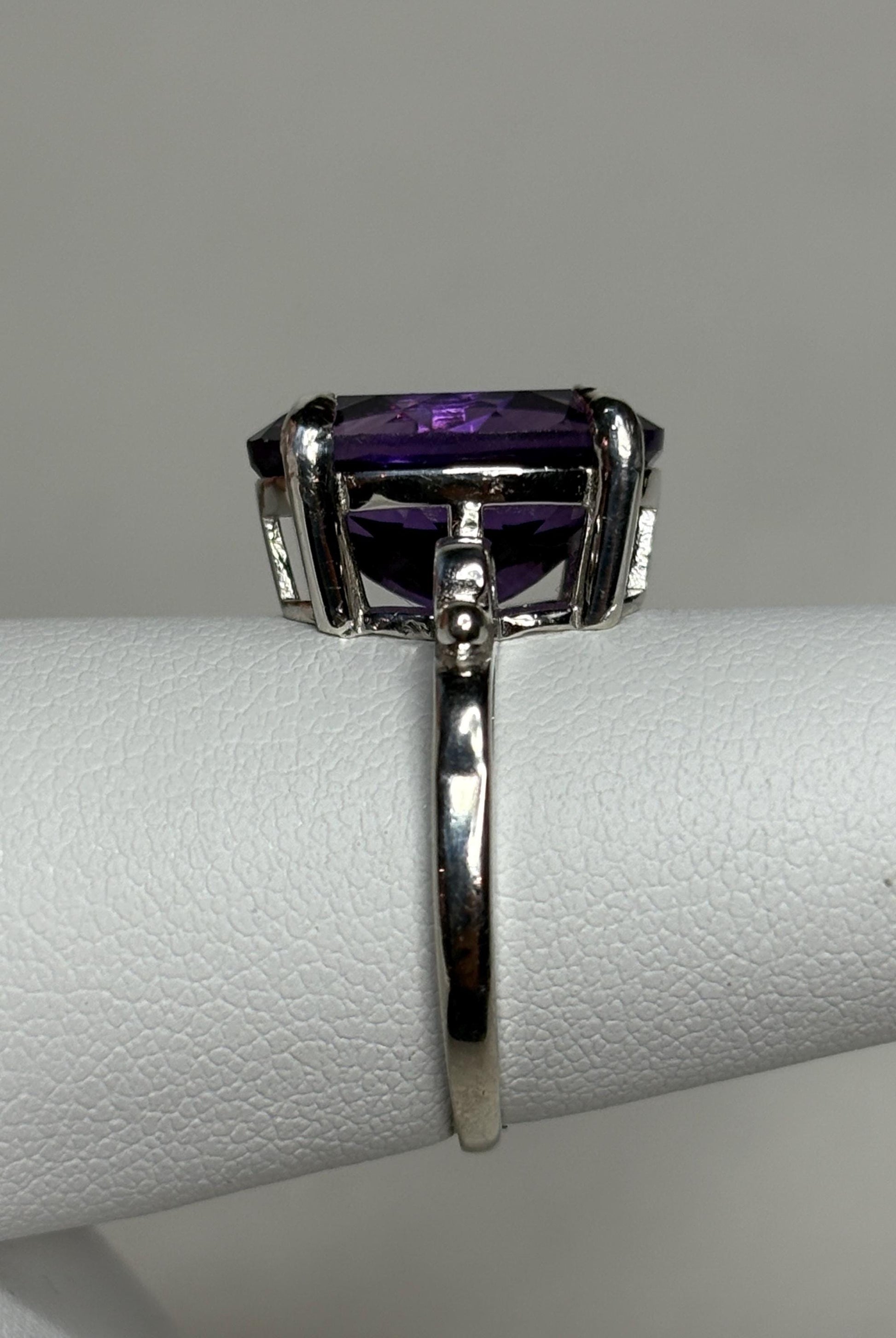Sterling silver ring with a large oval amethyst gemstone.
