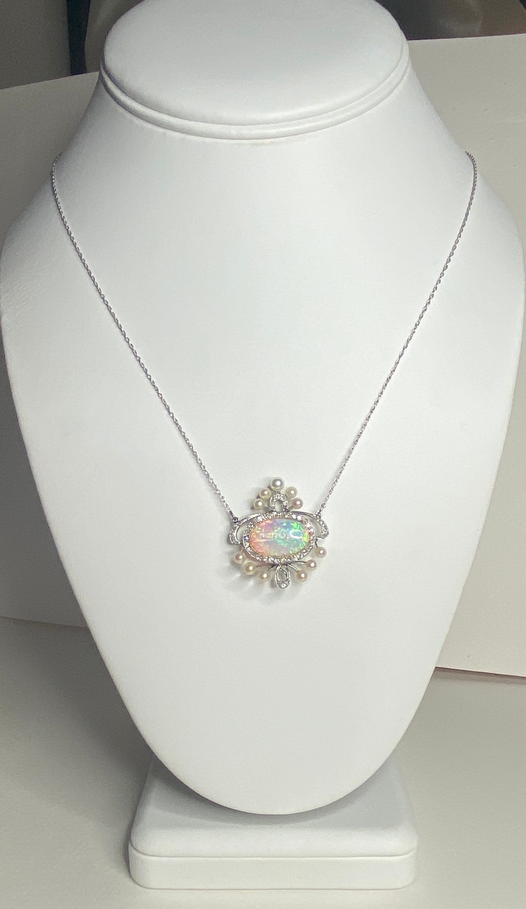 Edwardian platinum, gold, opal, pearl, and diamond pendant necklace.
