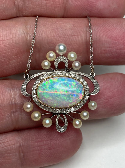 Edwardian platinum, 18k, and 14k gold pendant necklace with opal, pearls, and diamonds.