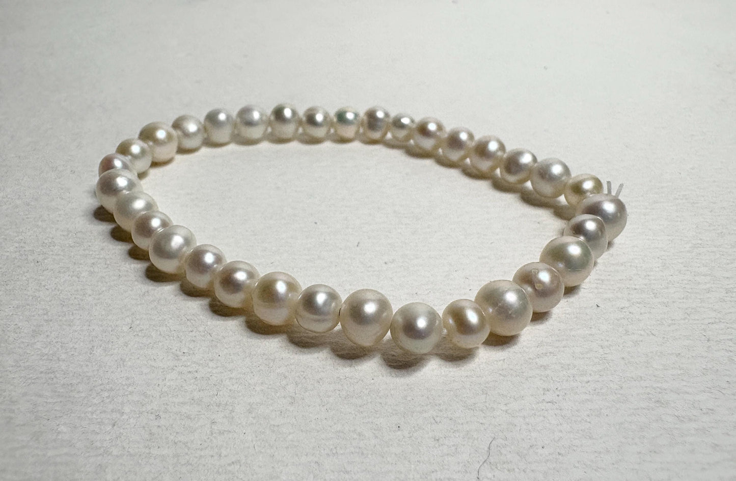 Freshwater cultured pearl stretch bracelet with baroque and potato-shaped pearls.