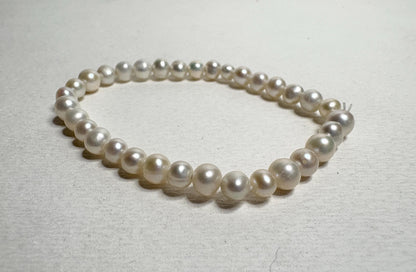Freshwater cultured pearl stretch bracelet with baroque and potato-shaped pearls.