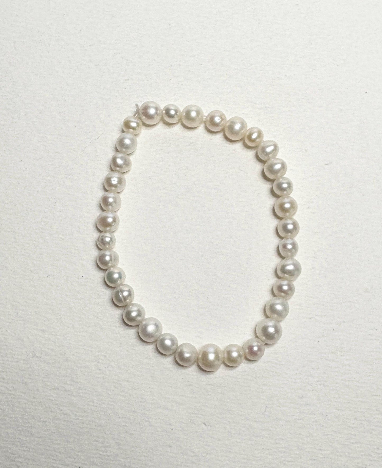 Freshwater cultured pearl stretch bracelet with baroque and potato-shaped pearls.