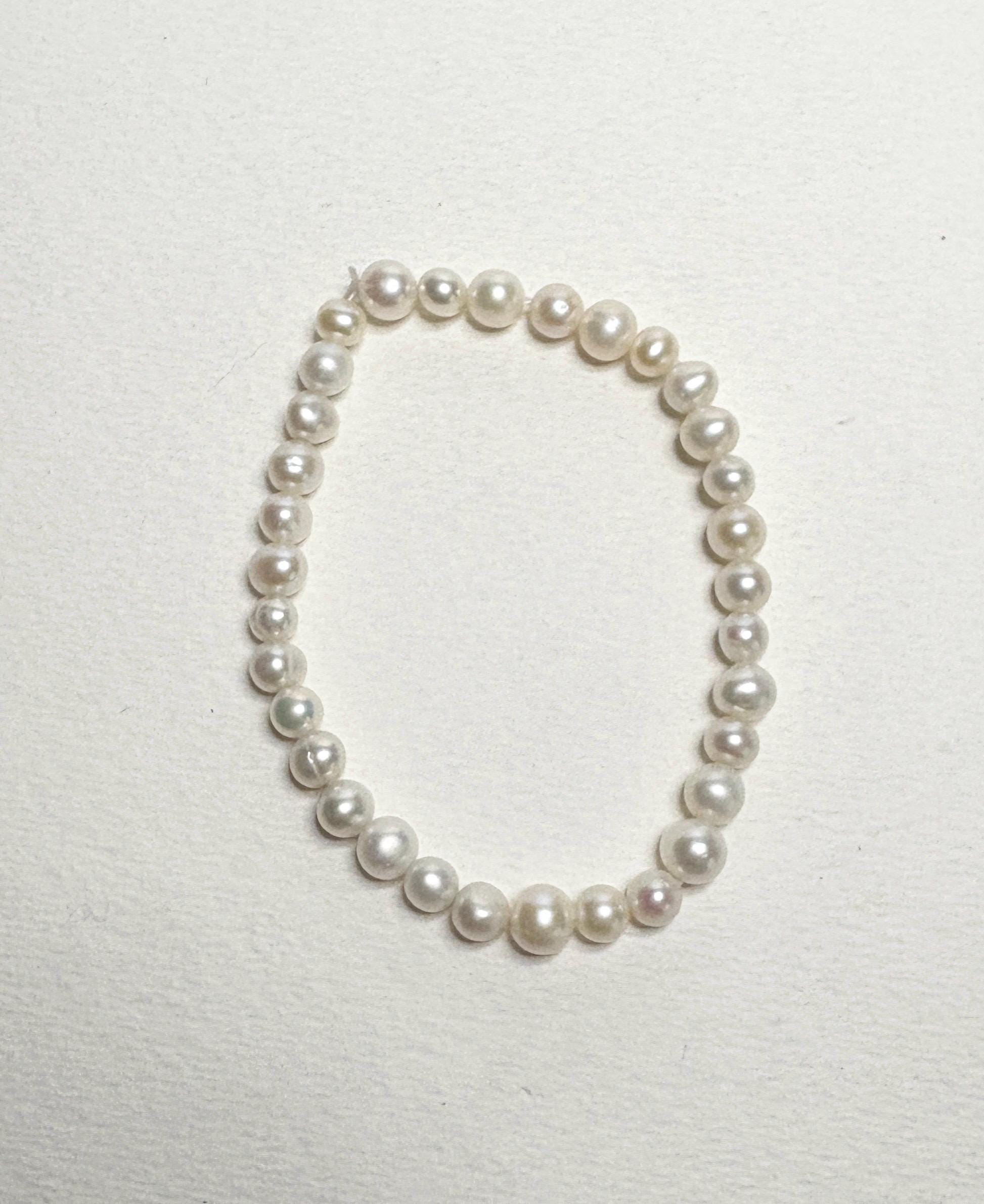 Freshwater cultured pearl stretch bracelet with baroque and potato-shaped pearls.