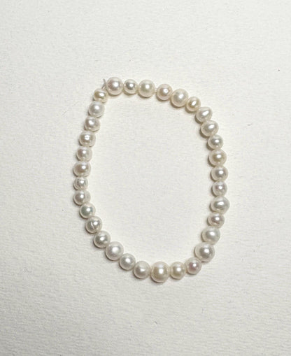 Freshwater cultured pearl stretch bracelet with baroque and potato-shaped pearls.
