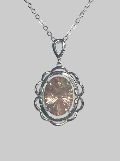 Sterling silver pendant necklace with a large oval fancy cut Oregon Sunstone.