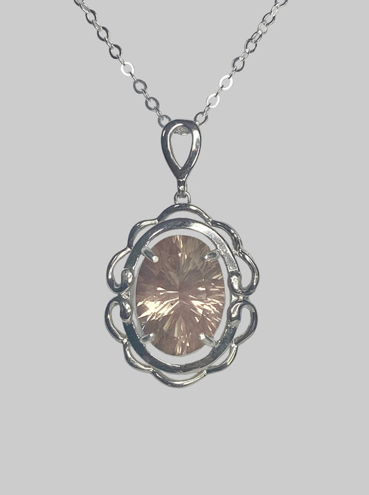 Sterling silver pendant necklace with a large oval fancy cut Oregon Sunstone.