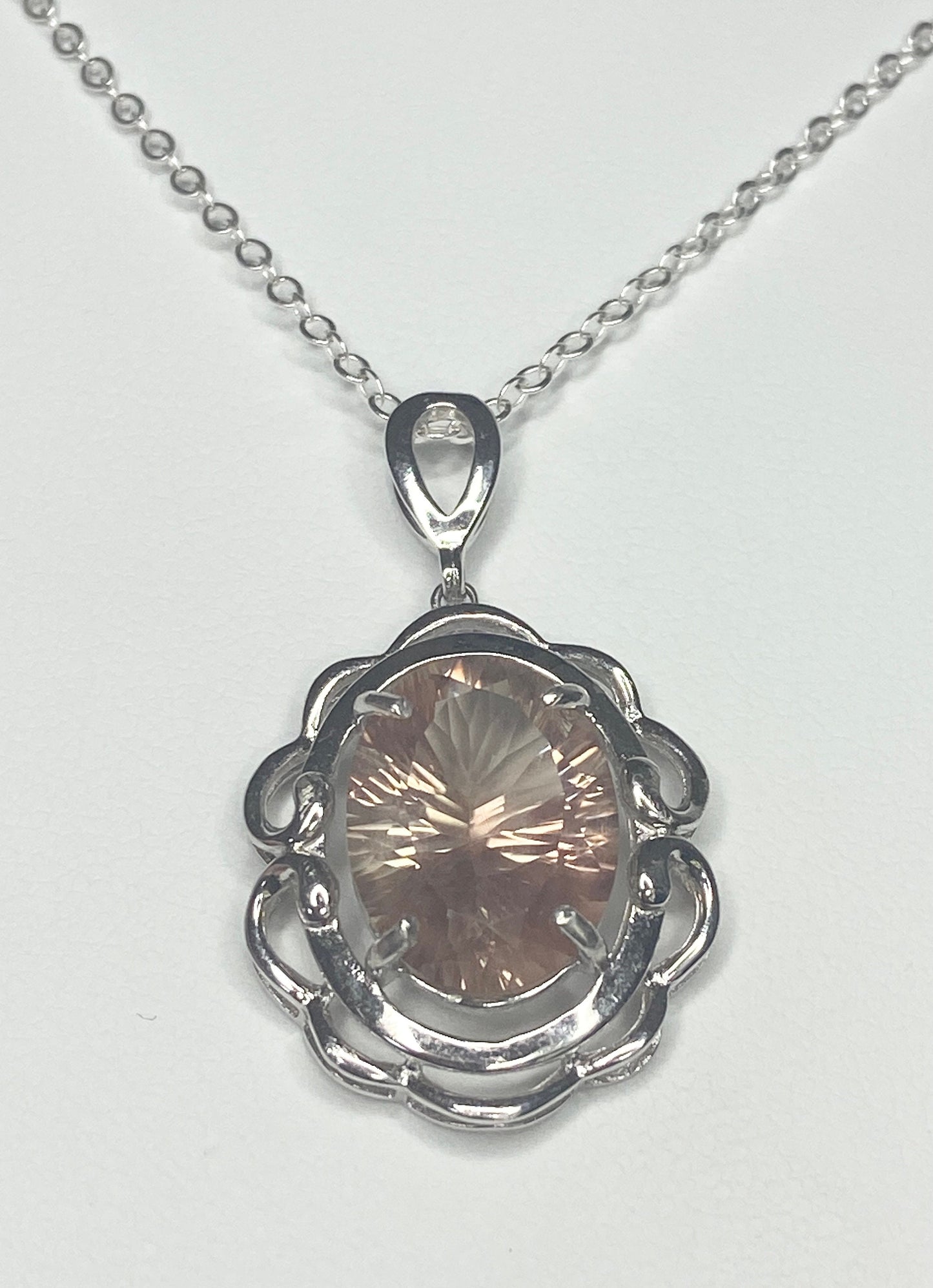 Oval fancy cut Oregon Sunstone sterling silver pendant necklace.
