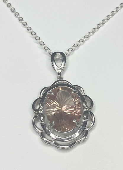 Oval fancy cut Oregon Sunstone sterling silver pendant necklace.