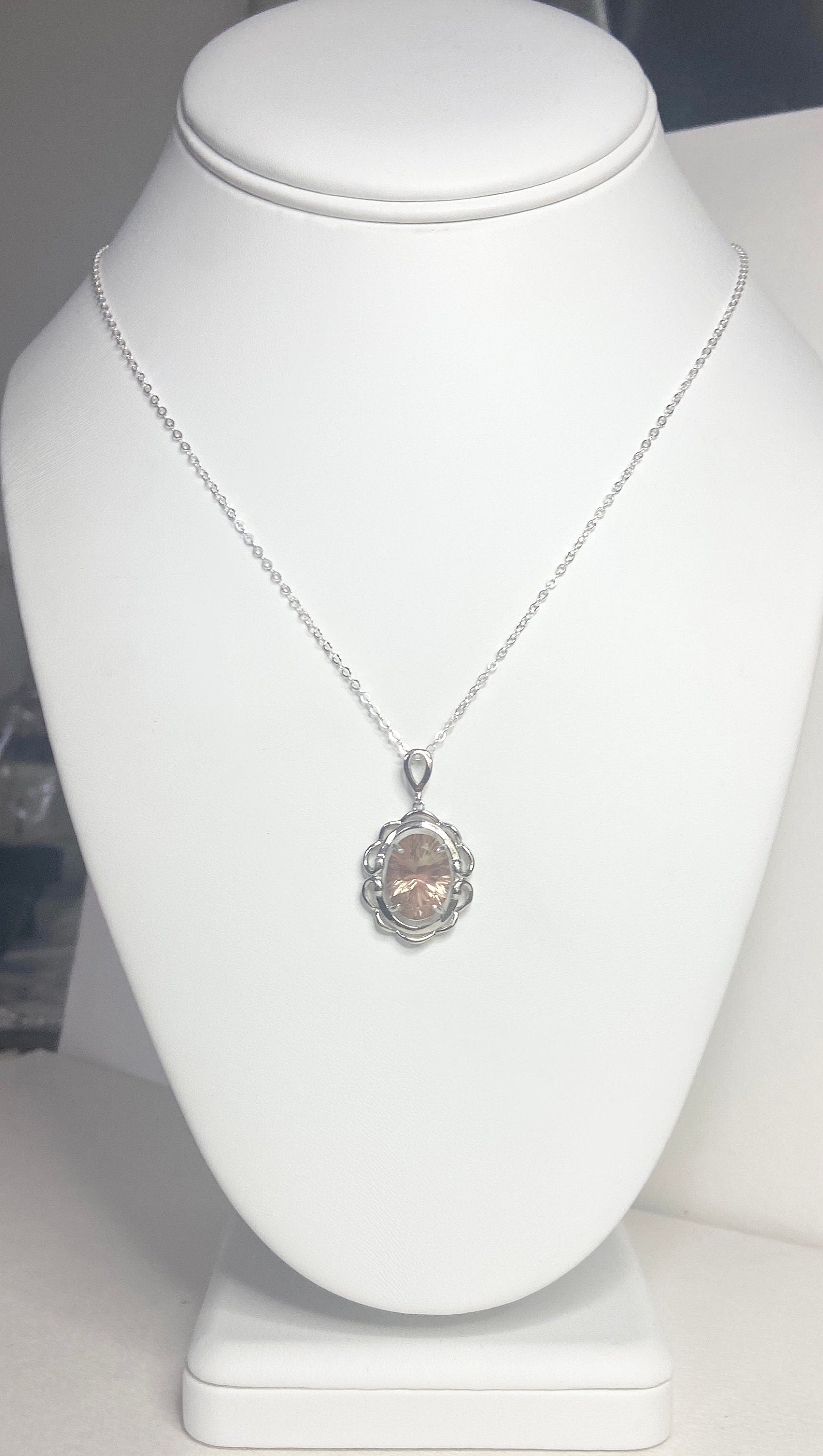 Oval fancy cut Oregon Sunstone pendant necklace in sterling silver.