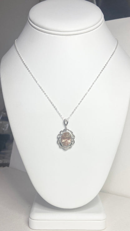 Oval fancy cut Oregon Sunstone pendant necklace in sterling silver.