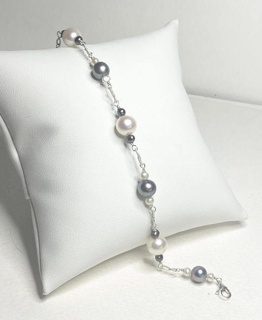 Sterling silver bracelet with Akoya, Tahitian, and freshwater pearls in black and white.
