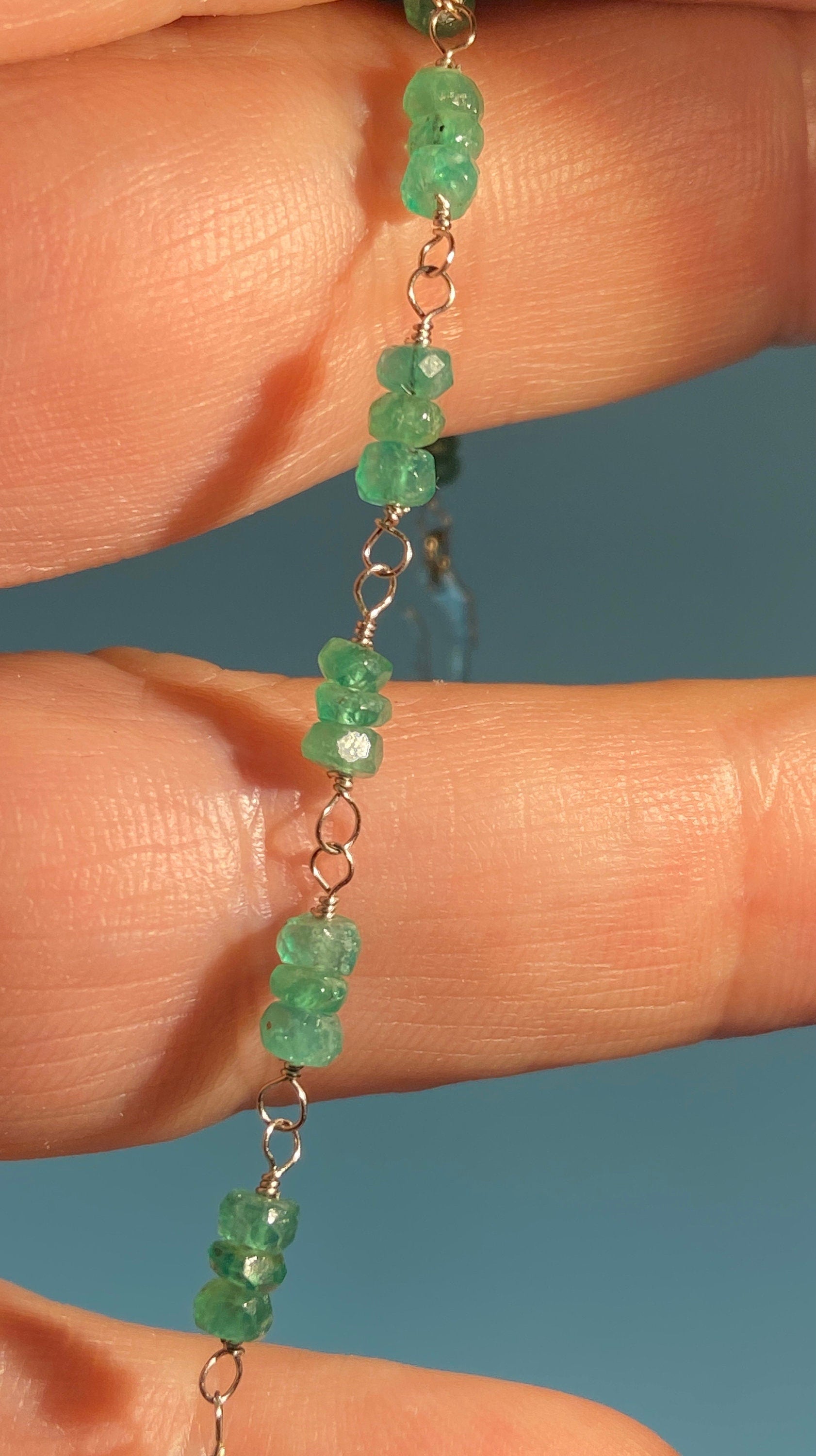 Natural emerald beaded bracelet on 10k white gold wire with a 14k white gold clasp.