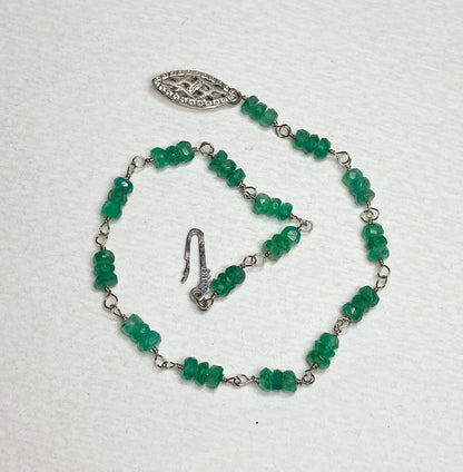 A 7.5 inch bracelet with natural emerald beads and a white gold clasp.