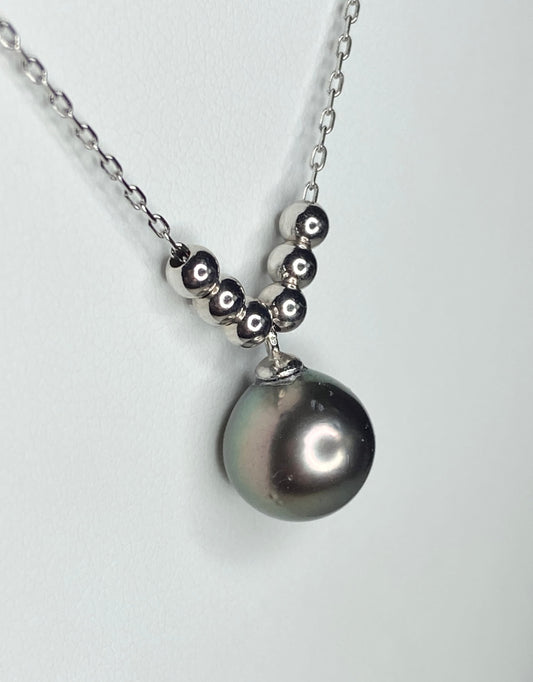 Tahitian cultured pearl pendant necklace with beads on an adjustable sterling silver chain.
