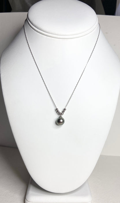 Sterling silver necklace with a Tahitian pearl pendant and silver beads.