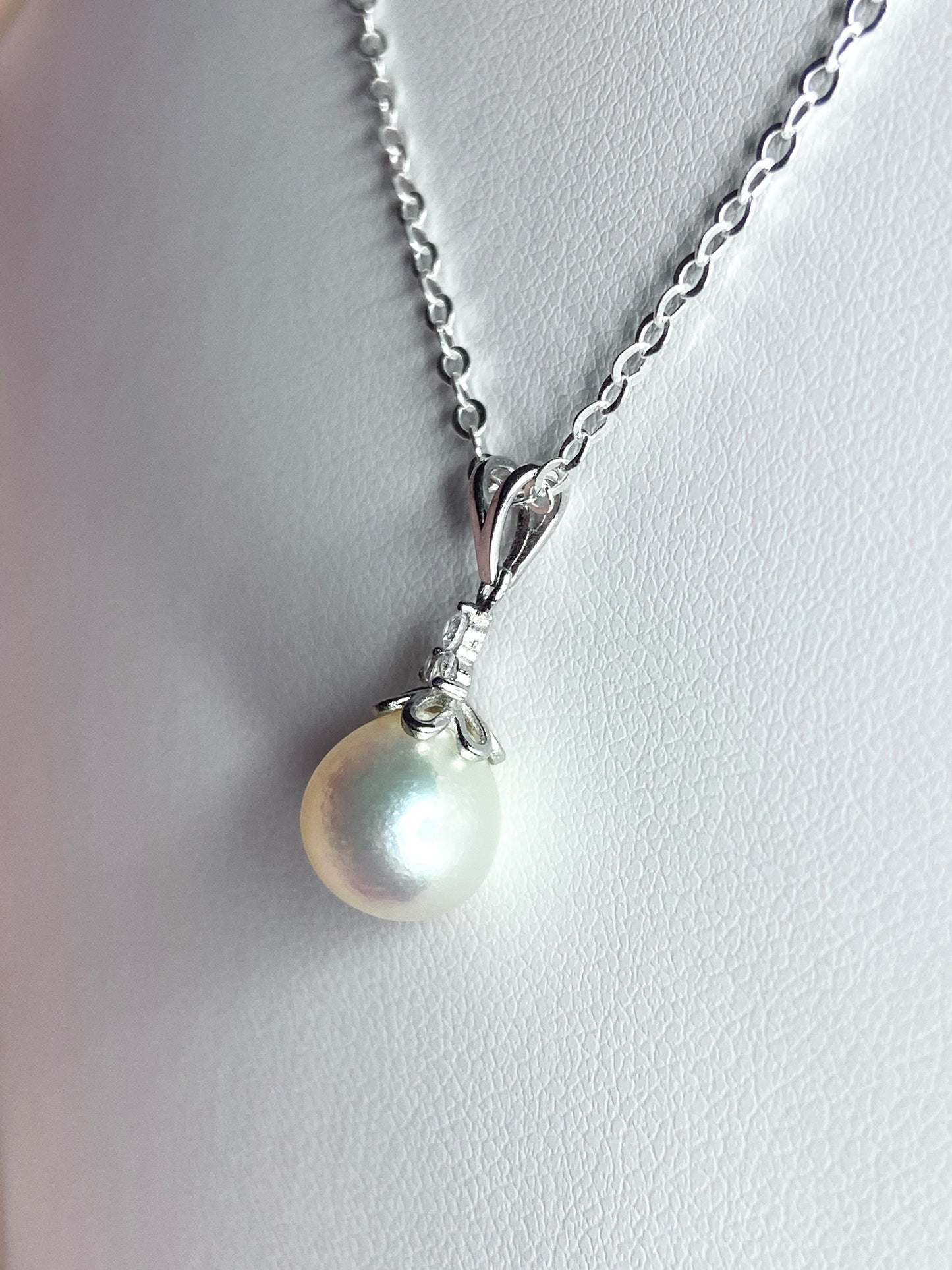 Sterling silver pendant necklace with a high-luster, out-of-round Akoya pearl.
