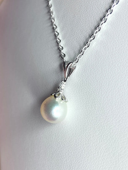 Sterling silver pendant necklace with a high-luster, out-of-round Akoya pearl.
