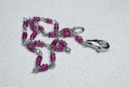 Sterling silver bracelet with hot pink spinel beads and a lobster clasp.