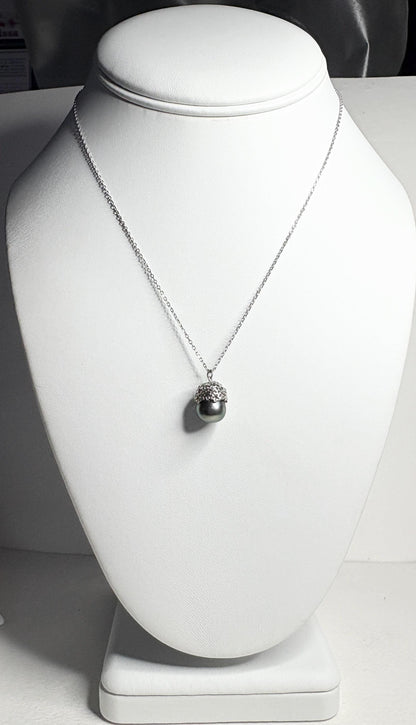 Tahitian cultured pearl pendant necklace with daisy design on an adjustable chain.