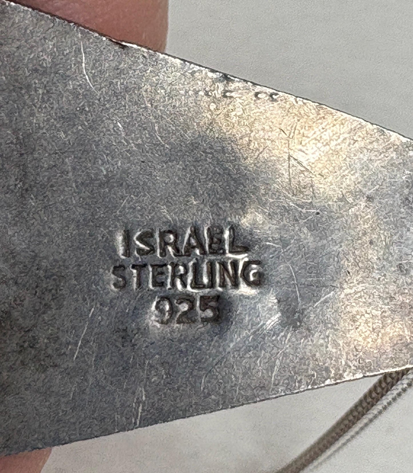Israeli sterling silver pendant with "ISRAEL STERLING 925" stamp.