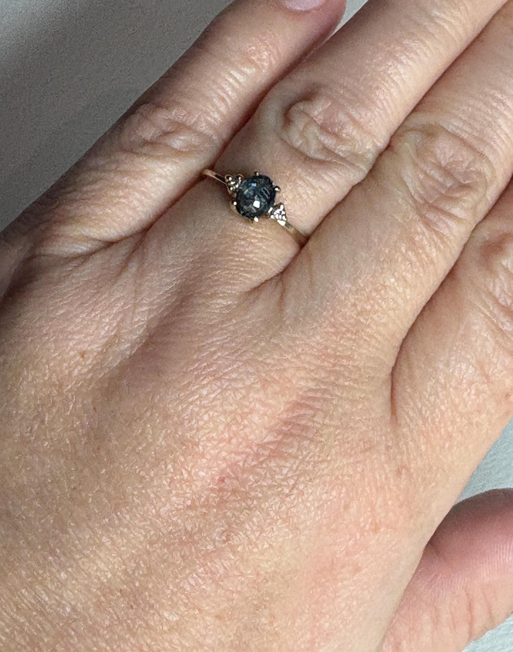 Montana sapphire and diamond ring in solid 14k yellow gold.