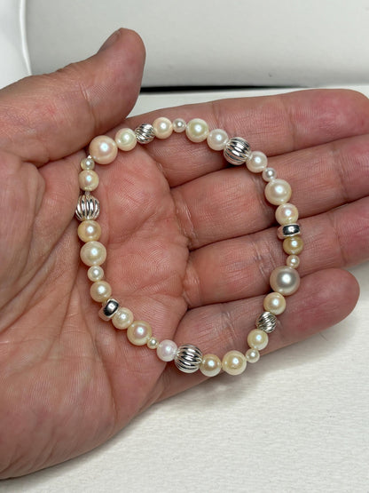 Stretch bracelet with Akoya cultured pearls and sterling silver beads.