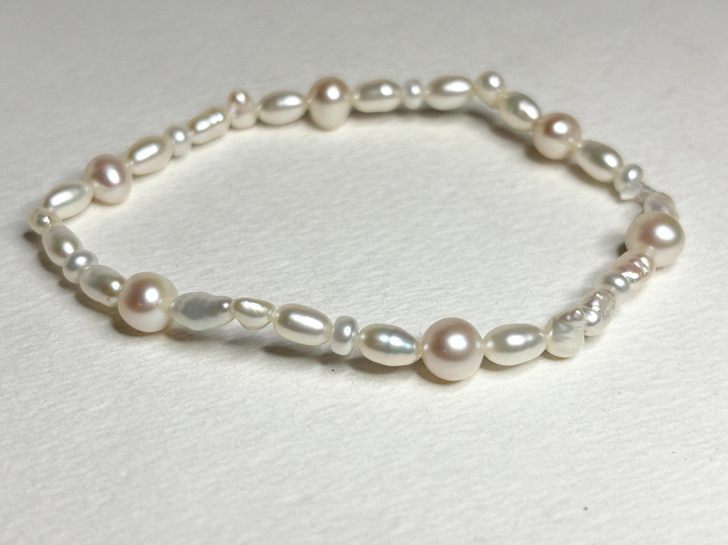 Freshwater cultured pearl rice and baroque stretch bracelet.