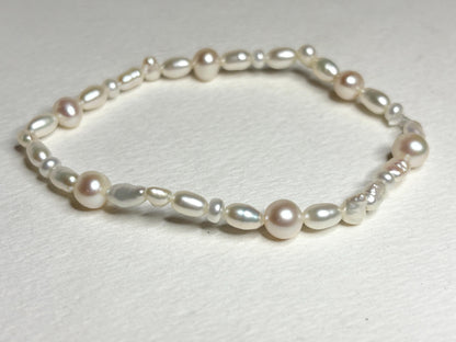 Freshwater cultured pearl rice and baroque stretch bracelet.