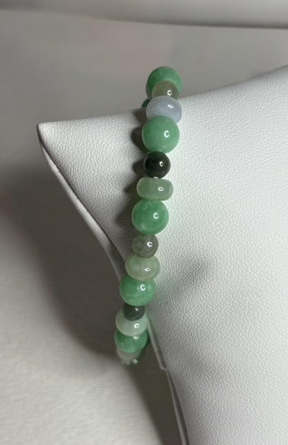 Burmese Type A jadeite jade stretch bracelet with mixed green beads.