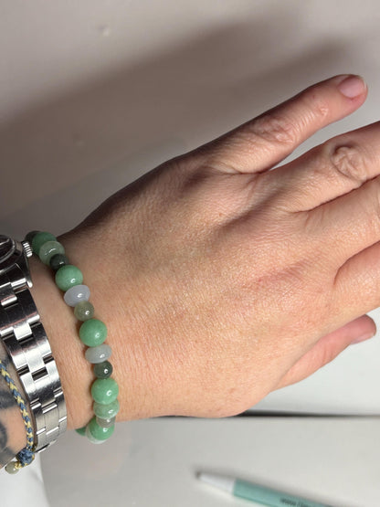 Burmese jadeite jade stretch bracelet with mixed green and white beads.