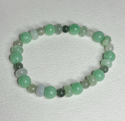 Burmese jadeite jade stretch bracelet with mixed green beads.