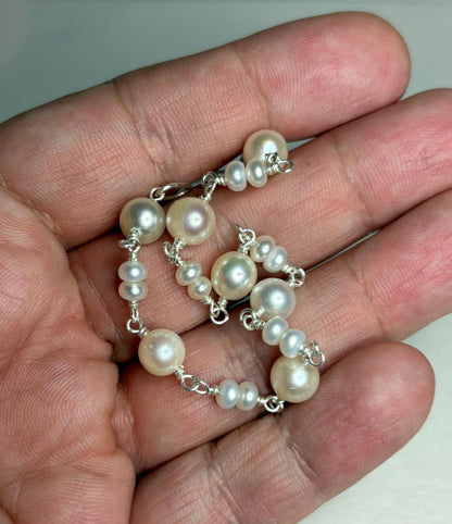 Sterling silver bracelet with cultured freshwater pearls.