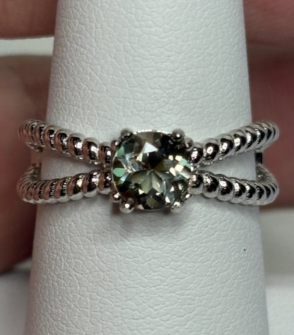 Sterling silver ring with a greenish Oregon sunstone and rope design.