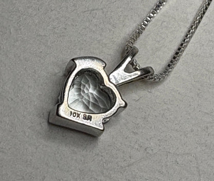 10k gold heart pendant with aquamarine and diamond on a sterling silver chain.