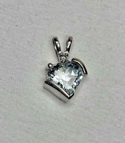Heart-shaped aquamarine and diamond pendant in 10k white gold.
