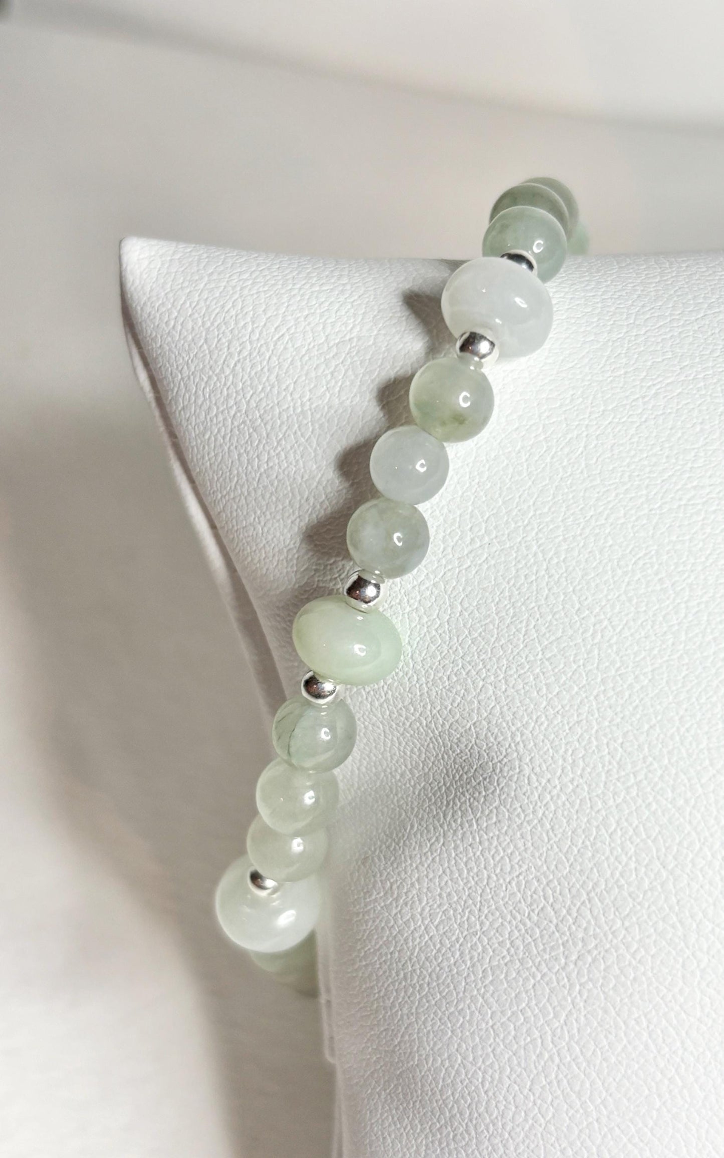 Natural Type A Icy Burmese Jadeite Jade Sterling Silver Stretch Bracelet with light green and white beads.