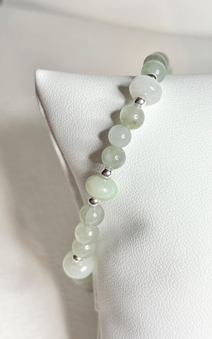 Natural Type A Icy Burmese Jadeite Jade Sterling Silver Stretch Bracelet with light green and white beads.
