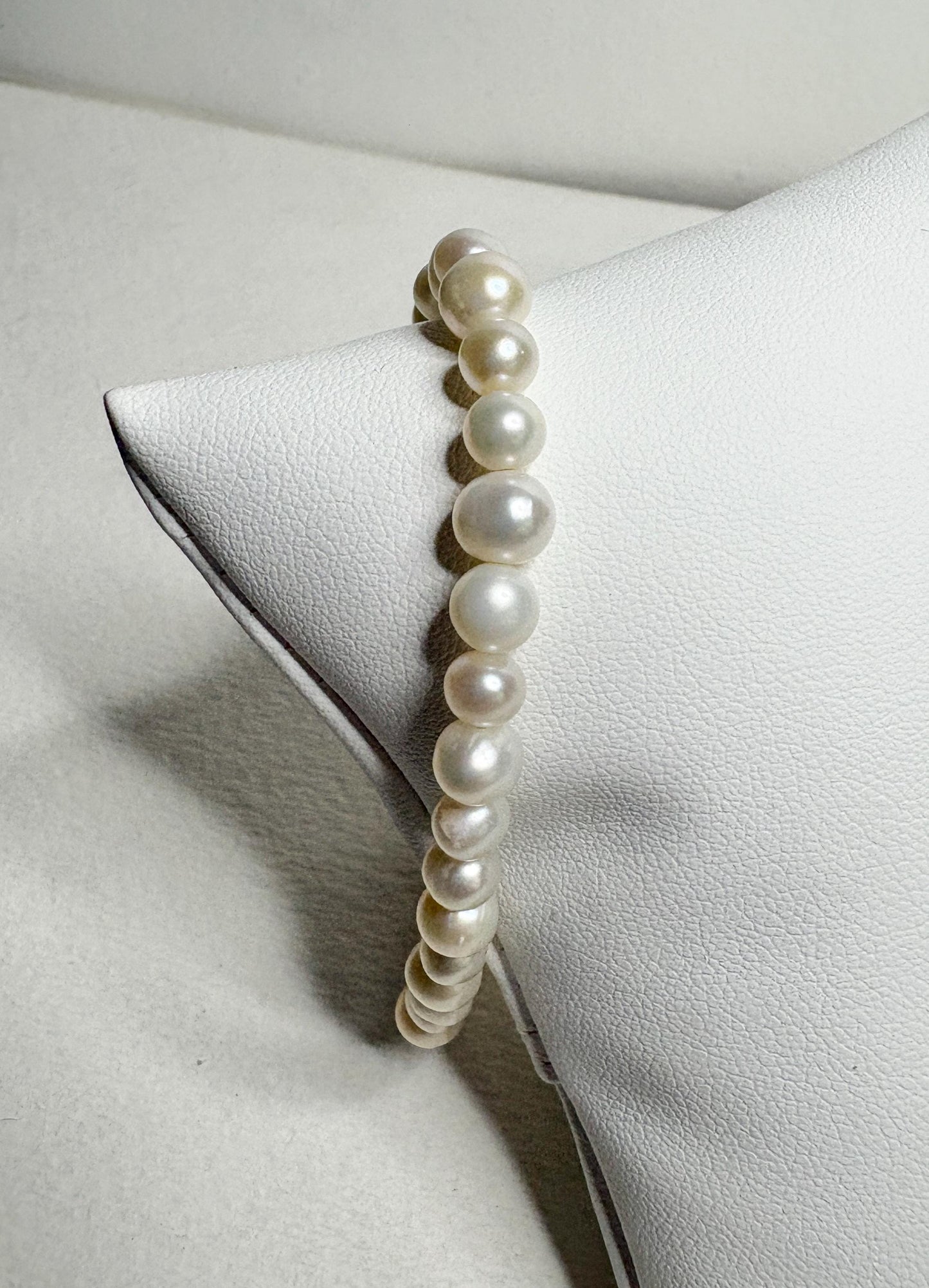Freshwater cultured pearl stretch bracelet with baroque and potato-shaped pearls.