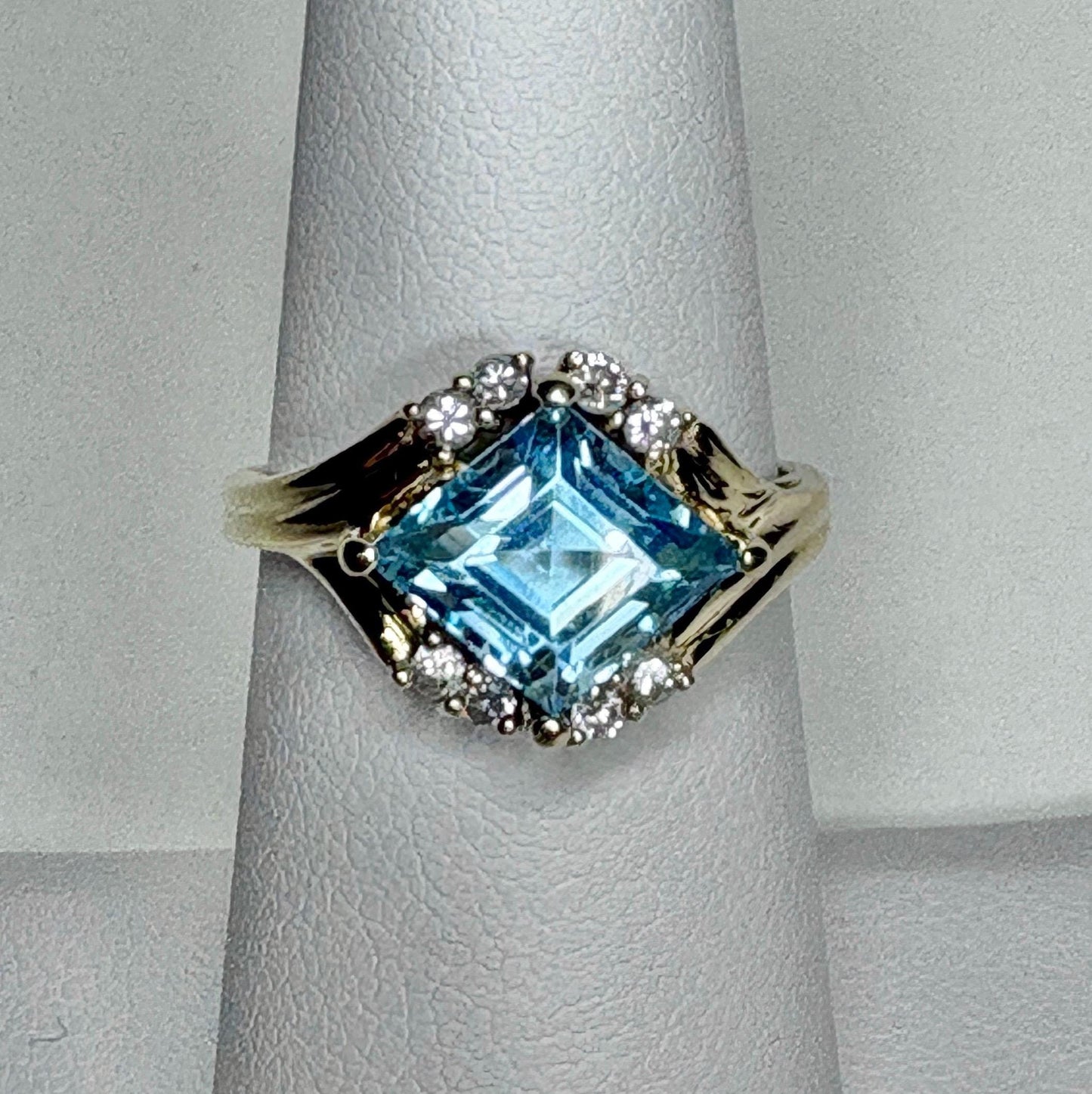 Fancy rhombus sky blue topaz and diamond ring in solid 14k gold.