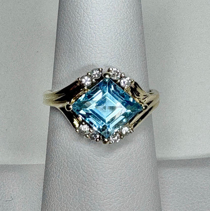 Fancy rhombus sky blue topaz and diamond ring in solid 14k gold.