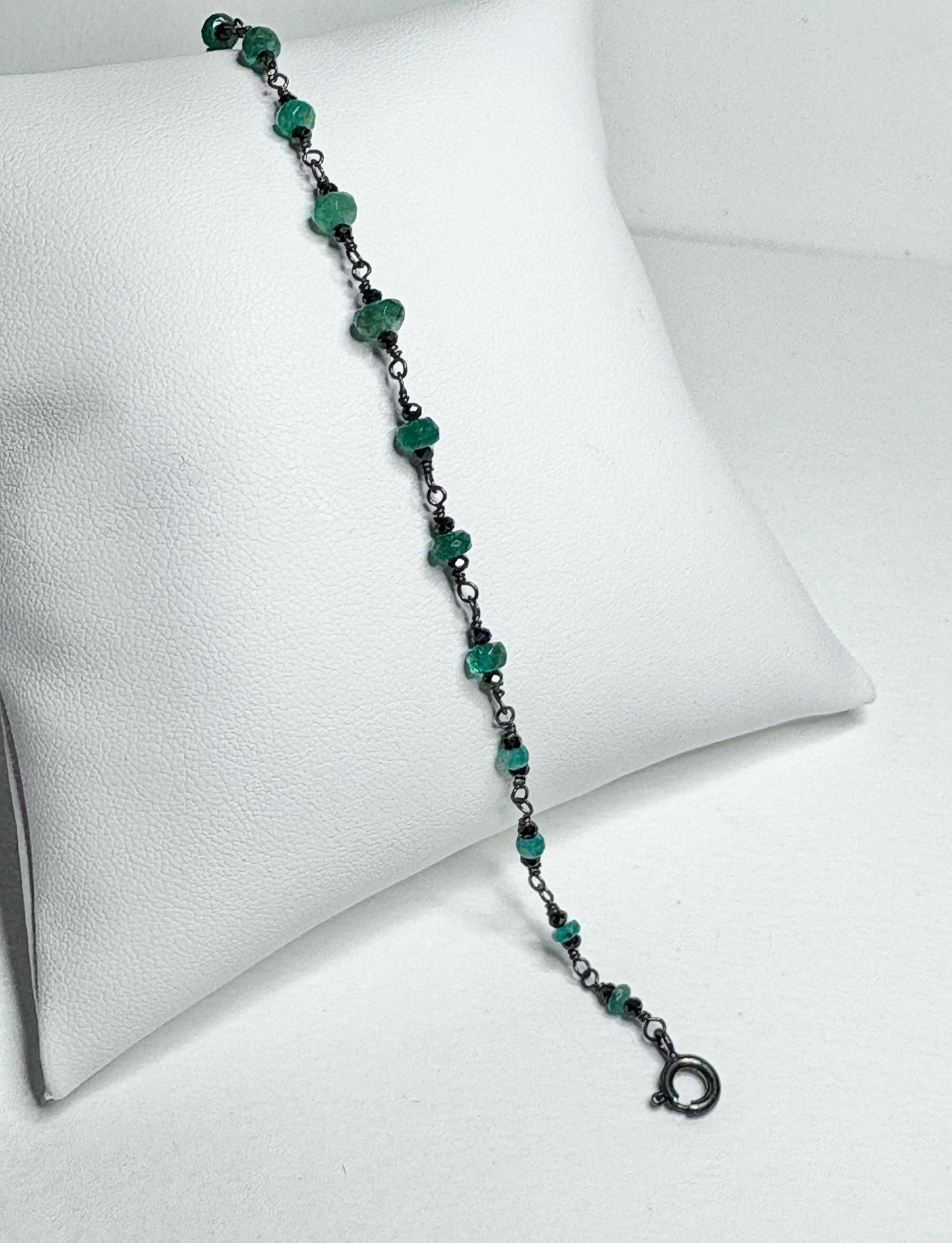 Oxidized sterling silver bracelet with natural emeralds and black diamond beads.
