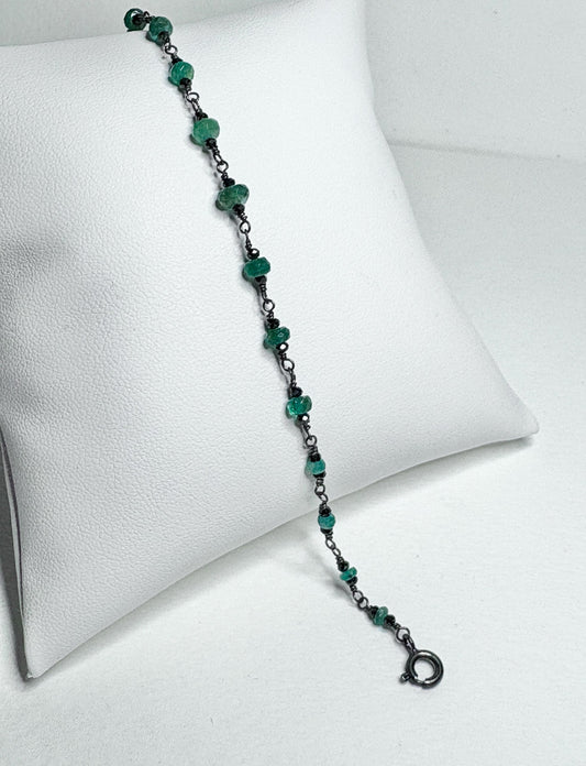 Oxidized sterling silver bracelet with natural emeralds and black diamond beads.