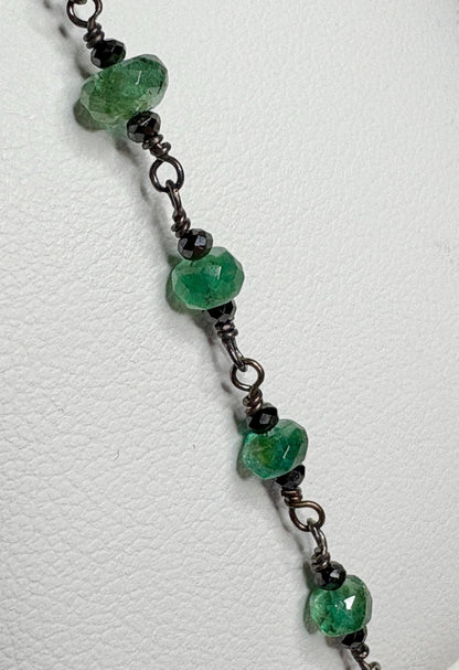 Oxidized sterling silver bracelet with faceted emeralds and black diamond beads.