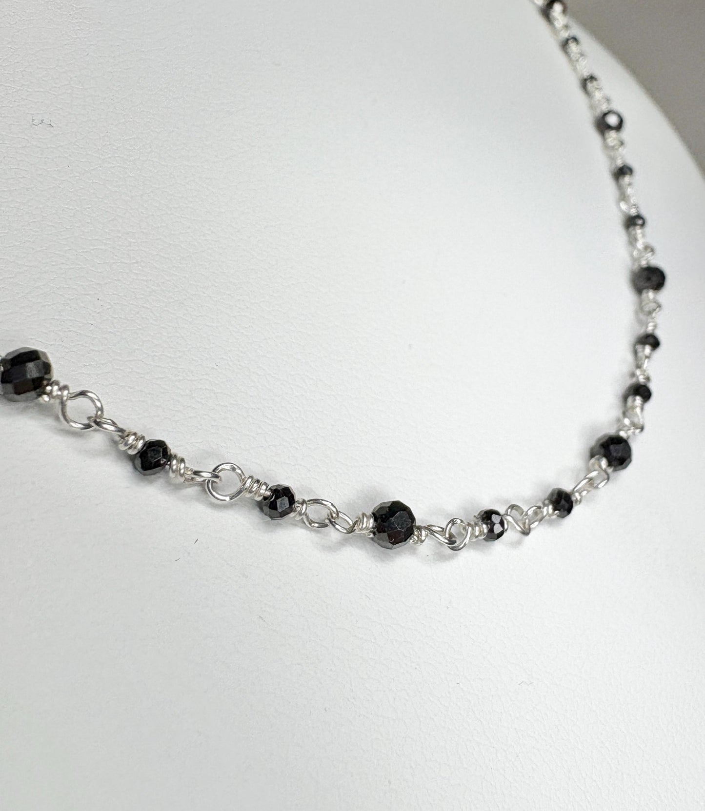 Sterling silver necklace with black diamond beads.