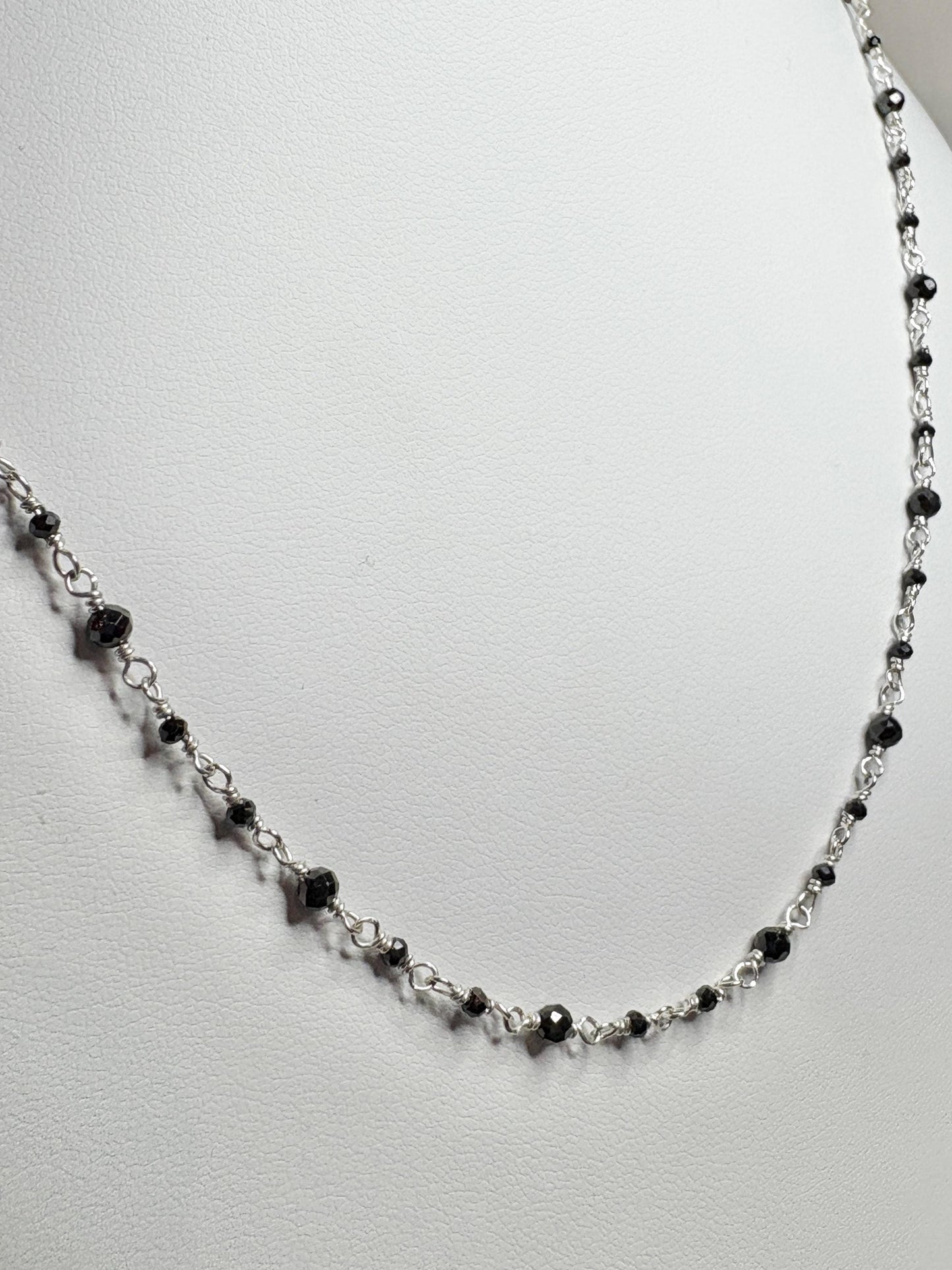 Sterling silver necklace with small black diamond beads.