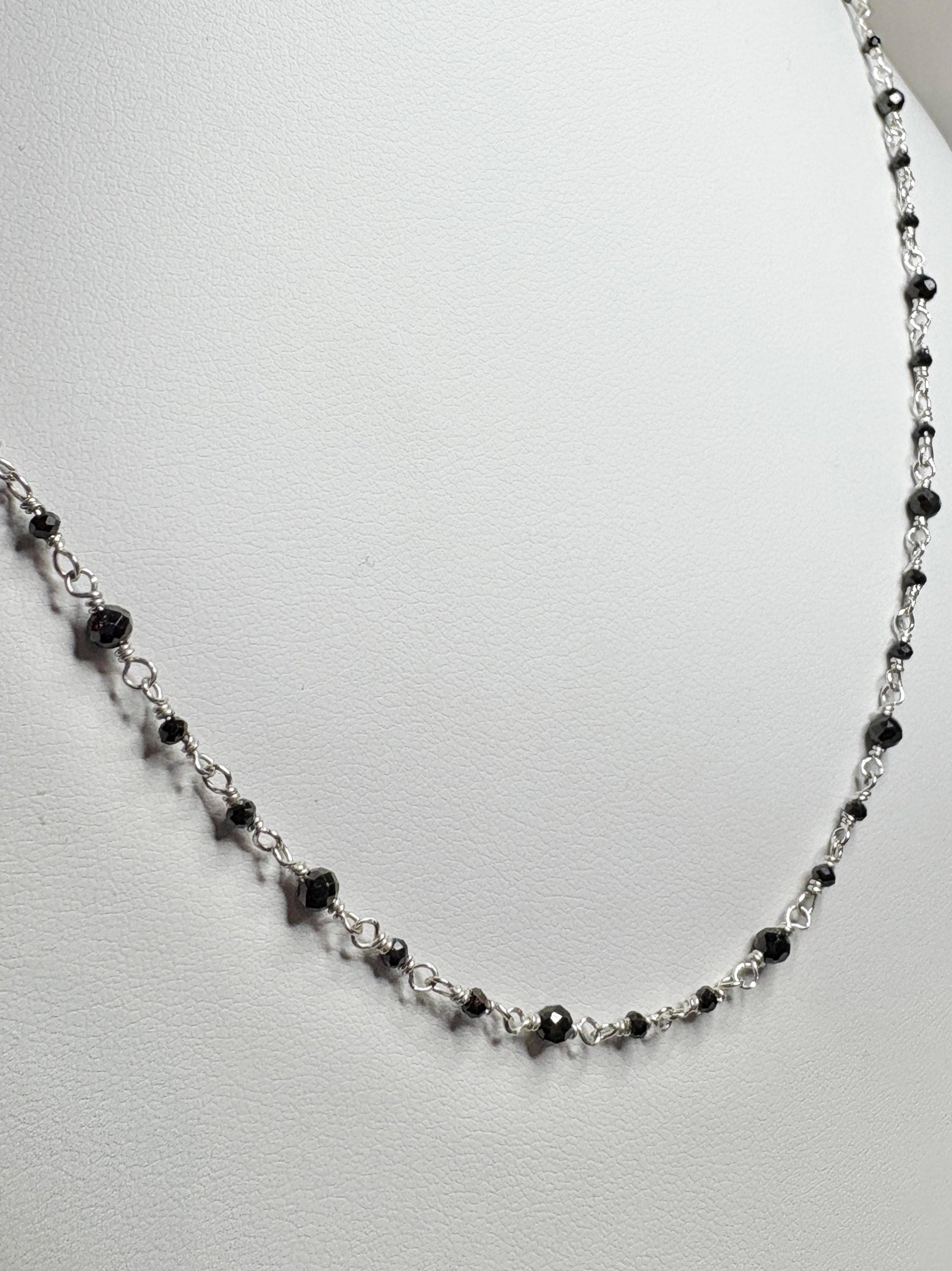 Sterling silver necklace with small black diamond beads.
