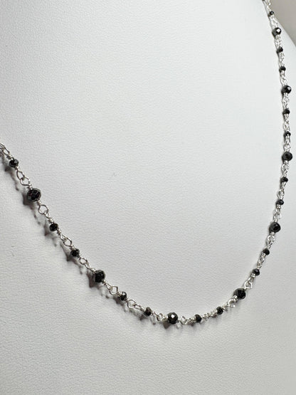 Sterling silver necklace with small black diamond beads.