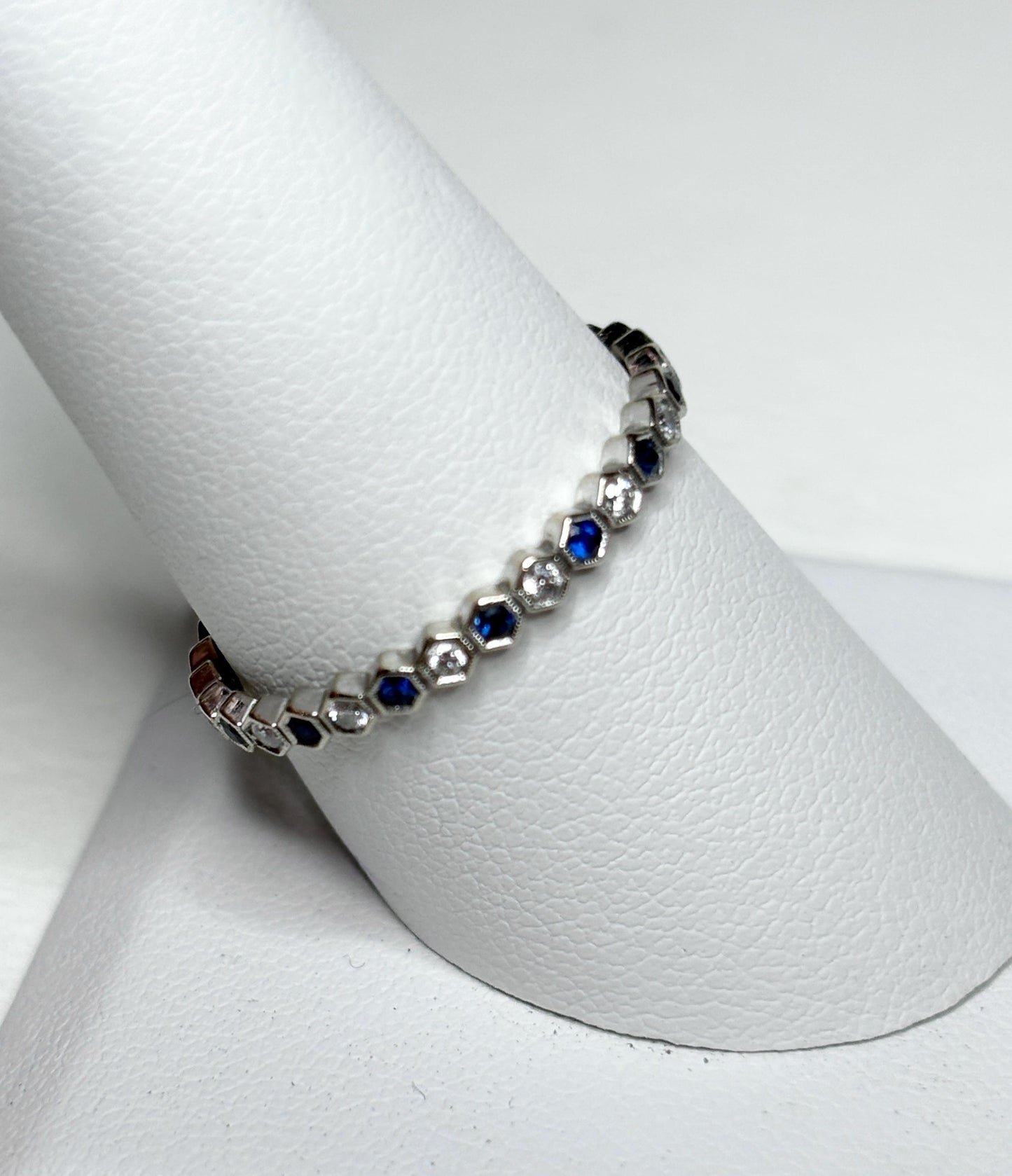 Sapphire and diamond honeycomb hexagon semi-eternity band ring in 14k white gold.
