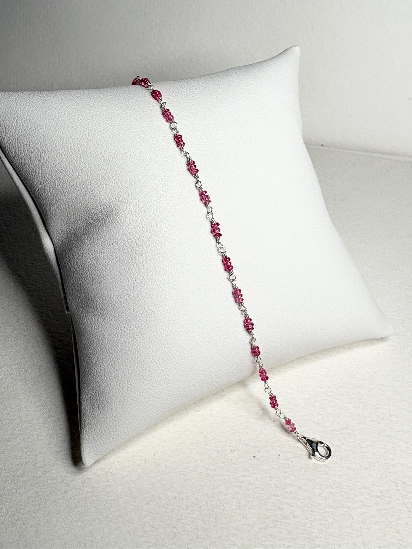 Sterling silver bracelet with hot pink spinel beads and a lobster clasp.